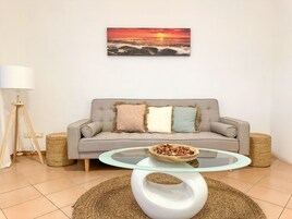 Basic Double or Twin Room | Living area | Flat-screen TV