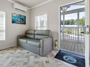 Deluxe Studio | Living area | Flat-screen TV
