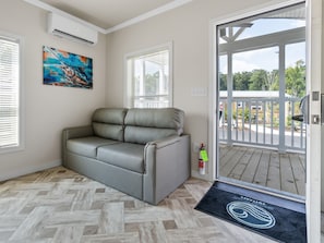 Deluxe Studio | Living area | Flat-screen TV