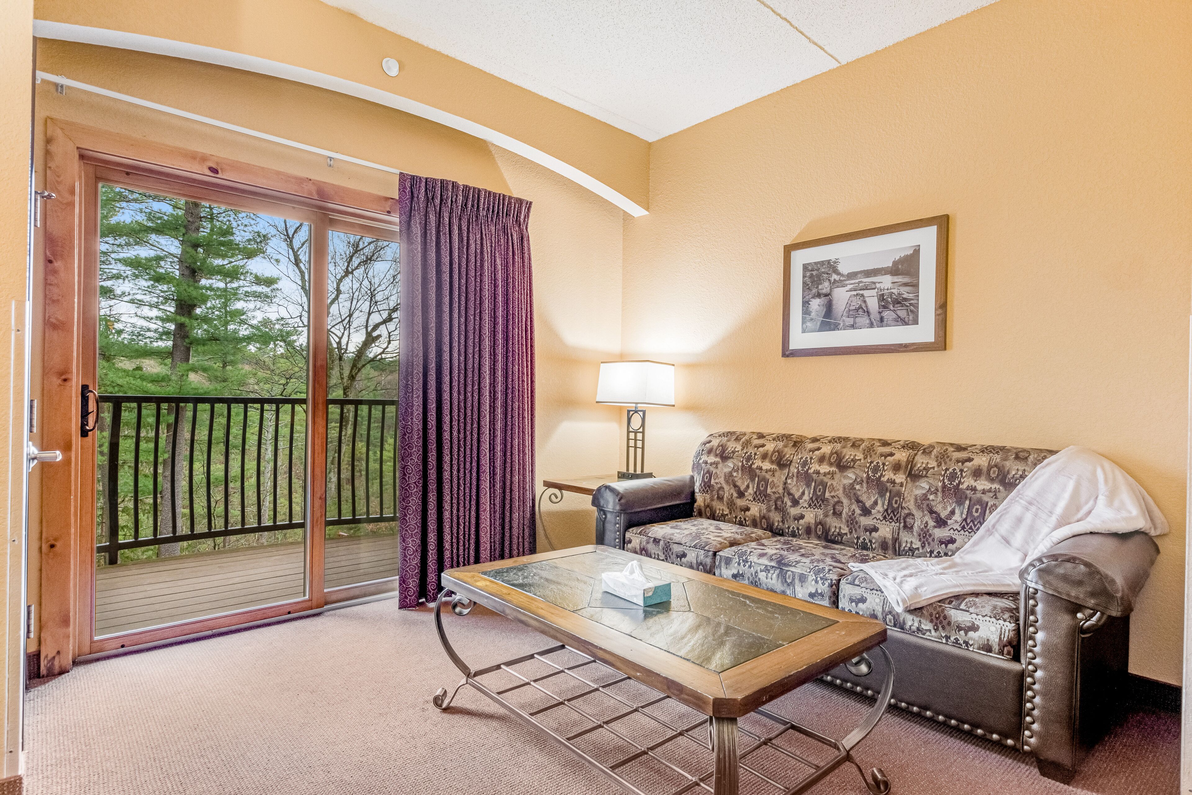 Studio condo near river with balcony, central AC, shared W/D, & quiet location