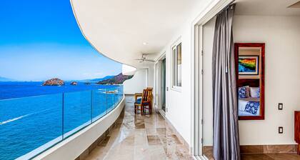 Oceanfront 9th-floor condo with balcony, water views & pool