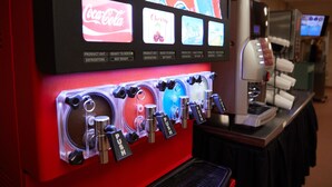 A beverage dispenser with multiple drink options and a coffee machine. - Target Hospitality - Big Spring Lodge (Big Spring)