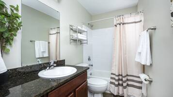 Bathtub, hair dryer, towels