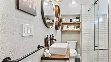 Shower, hair dryer, towels, soap