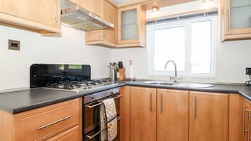 Fridge, electric kettle, toaster, cookware/dishes/utensils