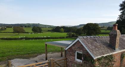 NEW - Private romantic cabin with stunning views towards the black mountain. 