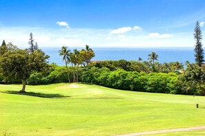 A golf course with a clear view of the ocean and lush greenery. - Kaanapali Plantation | Ocean View 3 BR | Car Incl. w/ 6+ Nights | KPL-46 by KBM (Lahaina)