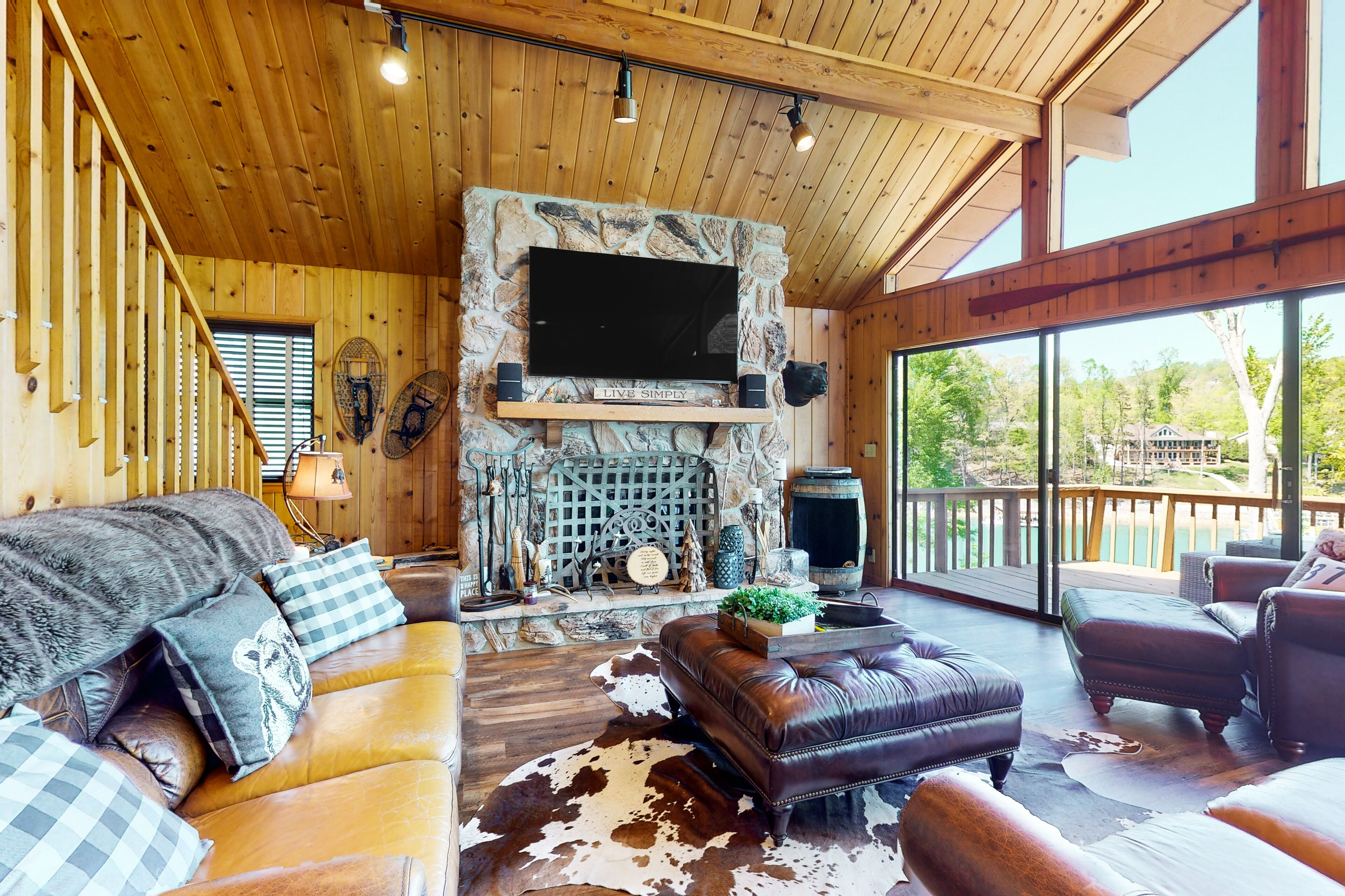 Charming lakefront home with private hot tub, dock, firepit, large deck & games