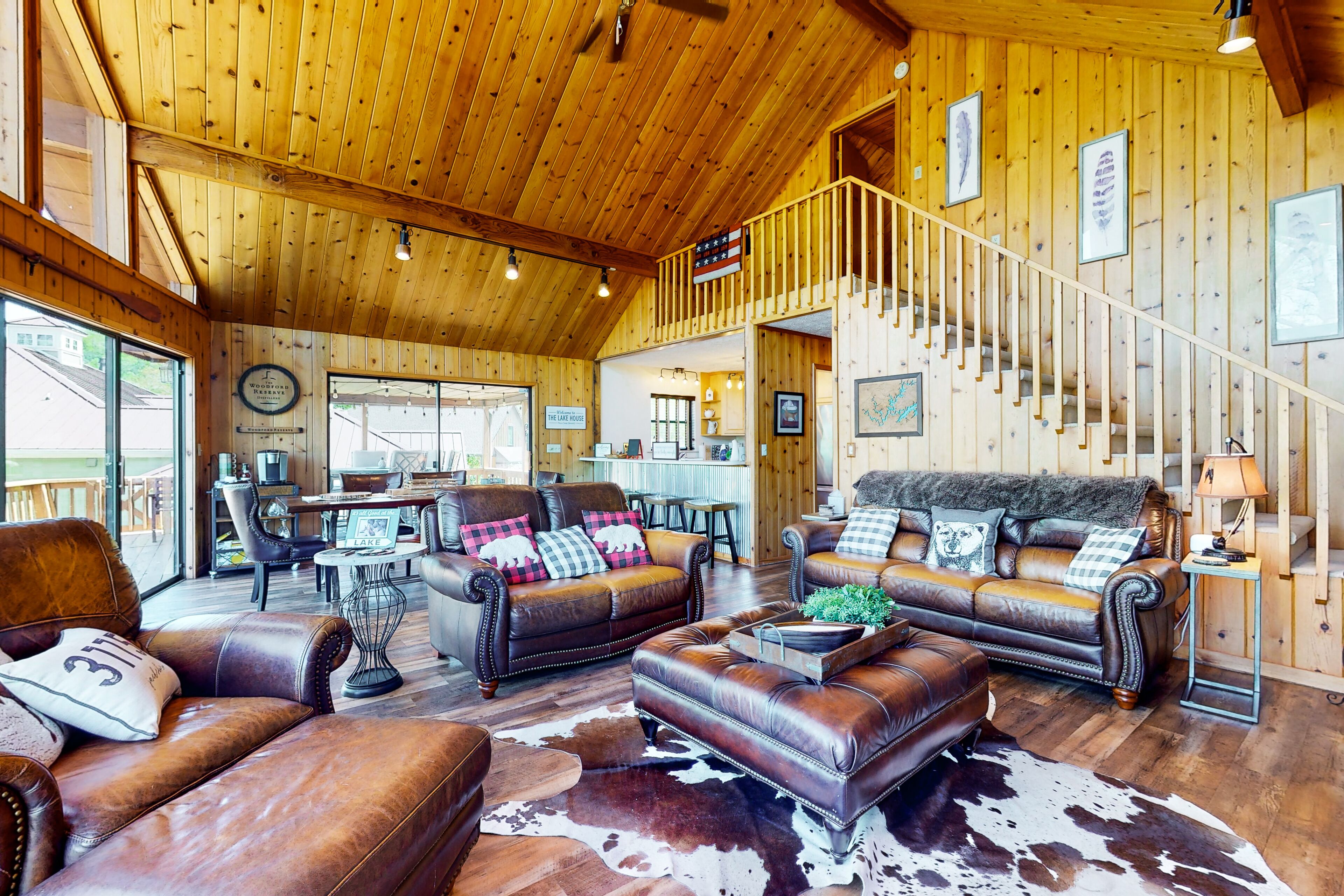 Charming lakefront home with private hot tub, dock, firepit, large deck & games