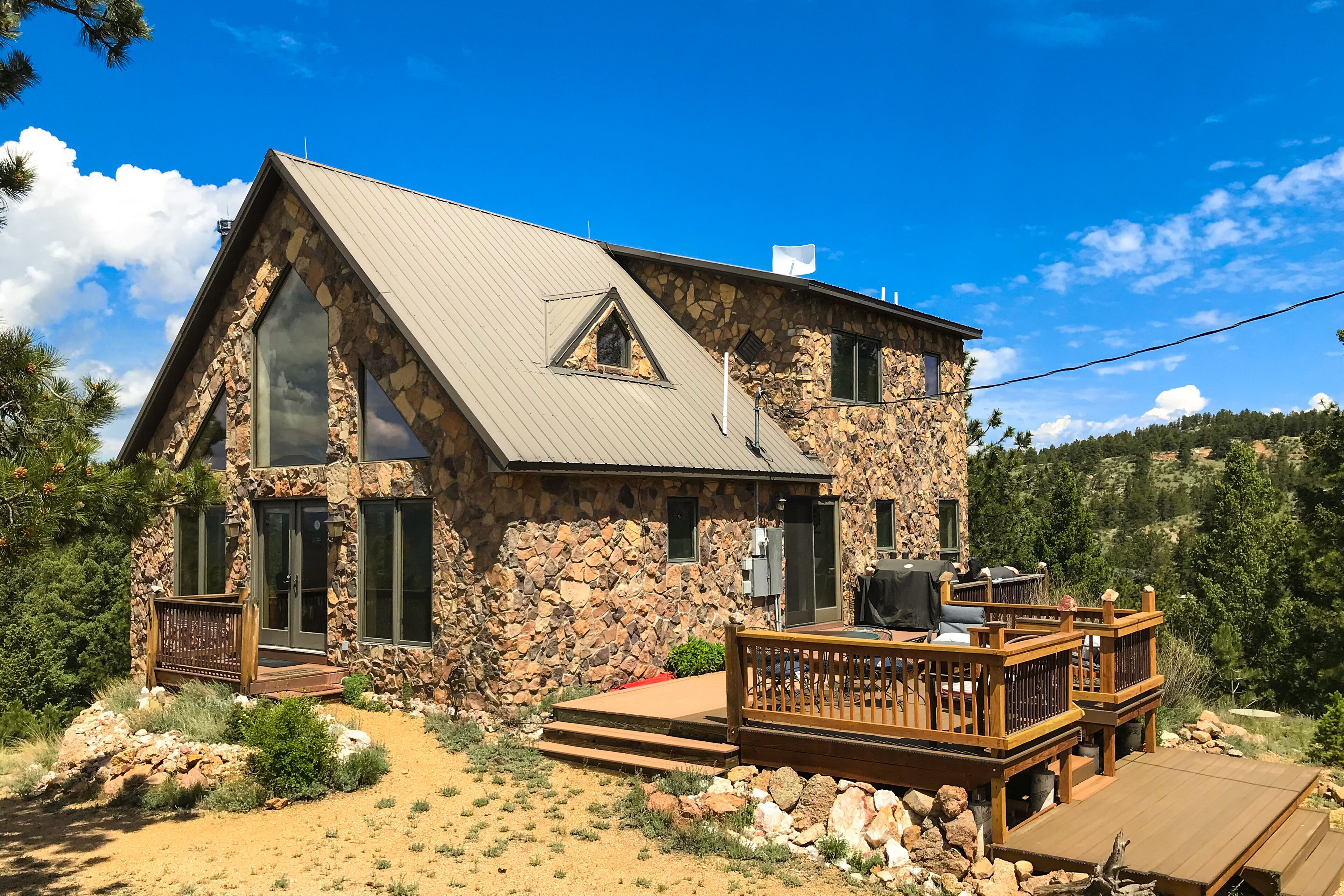 Secluded home on 5 acres with great mountain views, decks, wood stove & W/D
