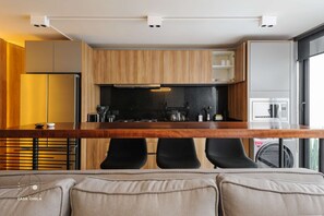 Fridge, microwave, stovetop, coffee/tea maker