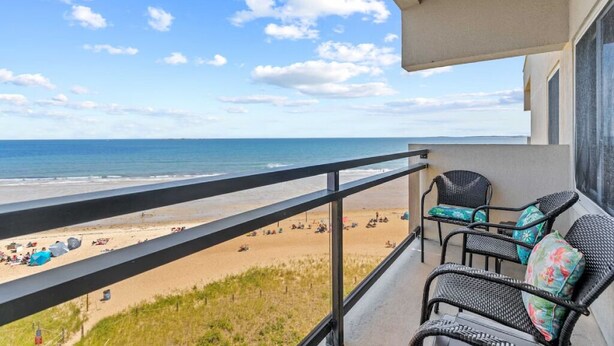 A balcony with a view of the beach and ocean. - Seawatch Oceanfront Unit 602 (Old Orchard Beach)