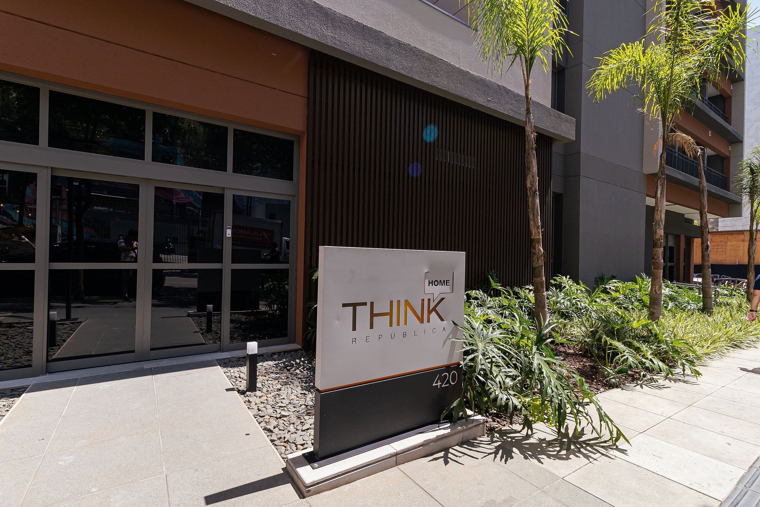 A modern building with a sign reading "THINK REPUBLICA" and the number 420.