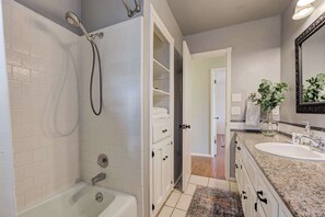 Bathtub, hair dryer, shampoo