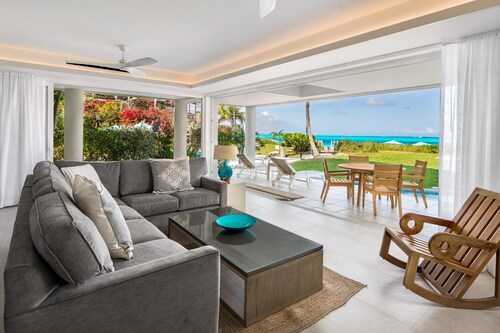 Exquisitely updated at Coral Gardens -directly on GRACE BAY BEACH!!!