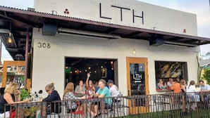 A restaurant named LTH with outdoor seating and a metal fence. - Coastal Compound - Two Fully Equipped 3BRs - 31+ Day Stay (Oceanside)