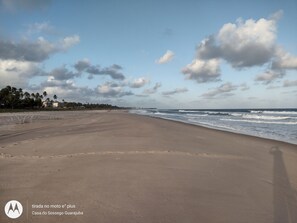On the beach, sun-loungers