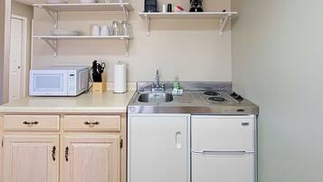 Microwave, stovetop, coffee/tea maker, cookware/dishes/utensils