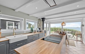 Fridge, stovetop, dishwasher, coffee/tea maker