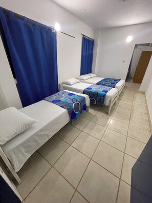 Family Quadruple Room | Desk, laptop workspace, free WiFi, bed sheets - Hotel Palma Azul Beach (Coveñas)
