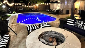 A backyard with a swimming pool, a fire pit, and outdoor seating. - Beautiful Home W/Heated Pool- Sleeps 16, Pets & Small Events Allowed W/Approval  (Mansfield)