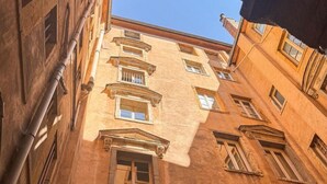 A multi-story building with arched windows and a central entrance. - The O1 - room 1 - Opera - 26m² (Lyon)