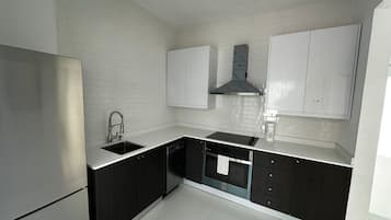 Premium Suite | Private kitchen | Full-sized fridge, microwave, oven, cookware/dishes/utensils