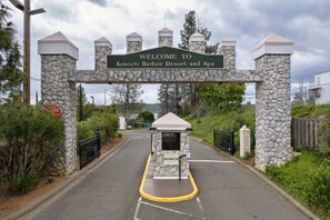 Enter through a stone archway and into a secure gated driveway.
