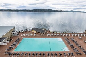 Seasonal outdoor pool, open 9:00 AM to 9:00 PM, pool umbrellas