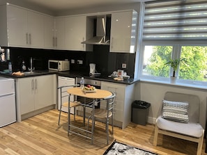 Full-sized fridge, microwave, freezer