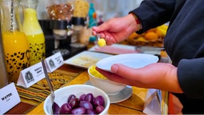 A breakfast buffet with various food items and beverages. - Inka House Inn (Machu Picchu)