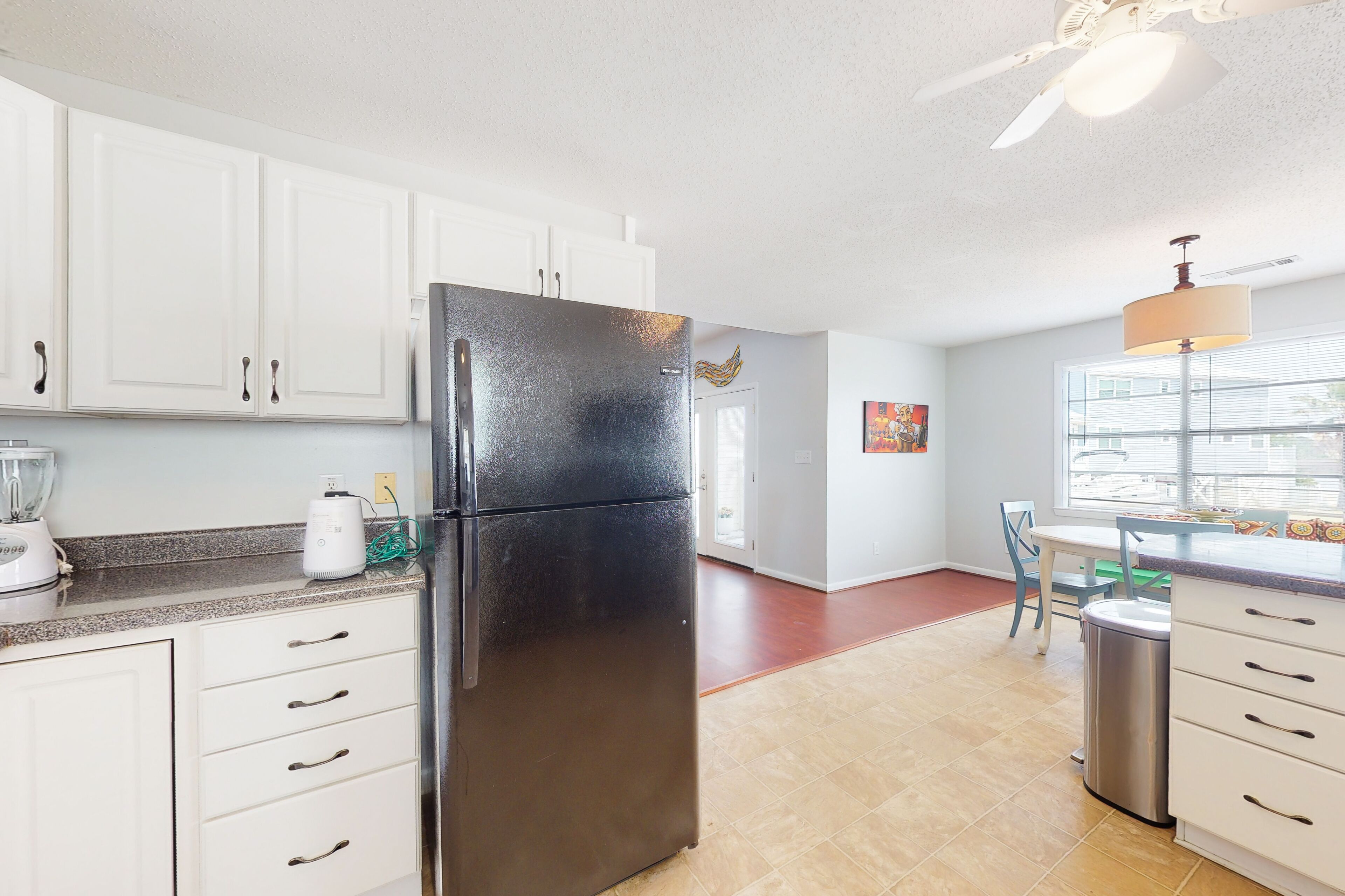 Water-view home with backyard dock, near white sand beaches