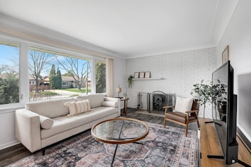 Relax in this cozy living room tons of natural light pouring in. 