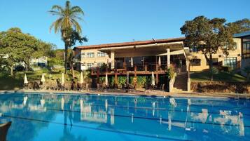 Outdoor pool, pool umbrellas, sun loungers