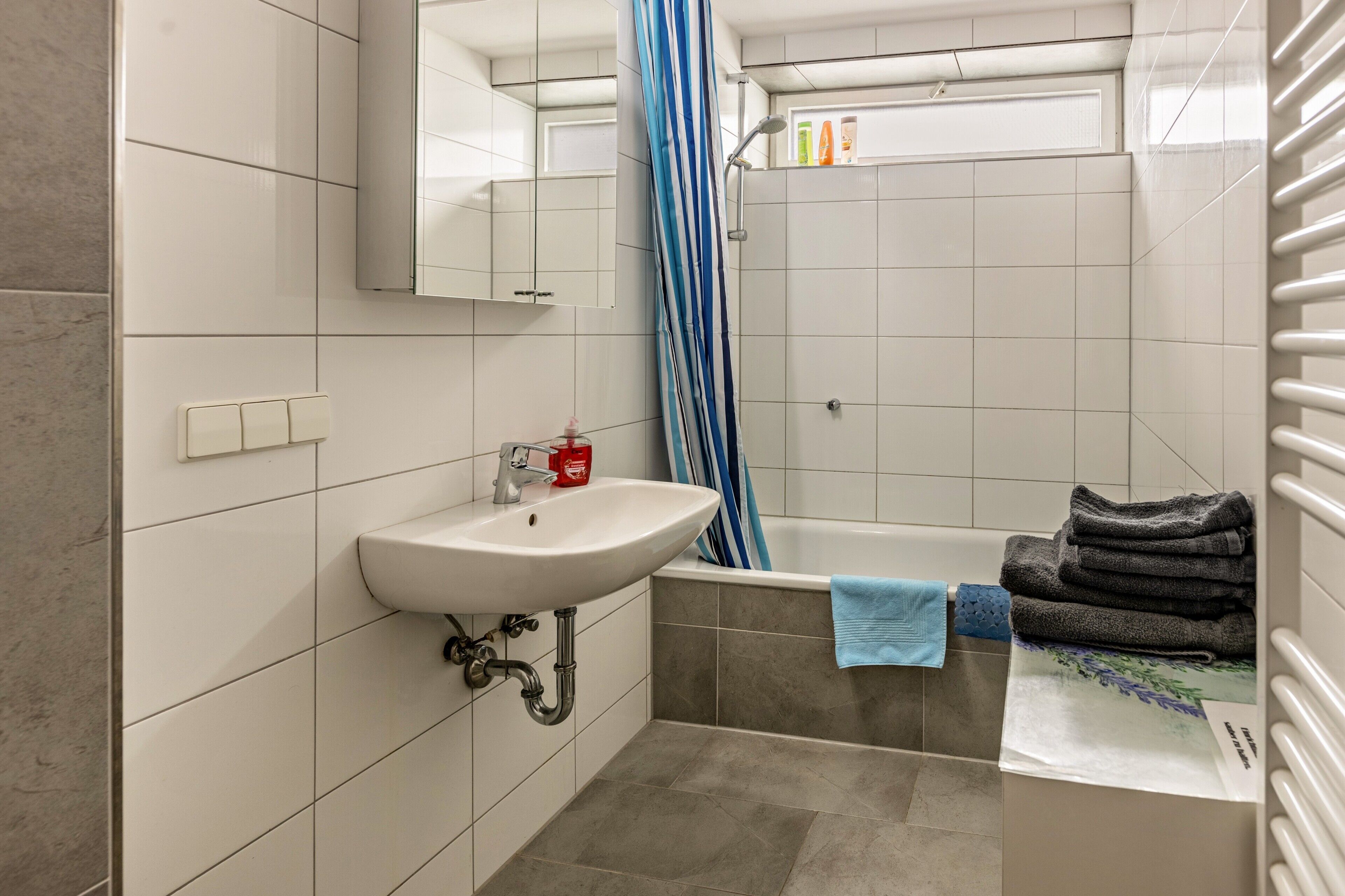 Bathtub, hair dryer, towels