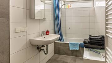 Bathtub, hair dryer, towels