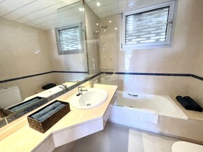 Bathtub, hair dryer, towels