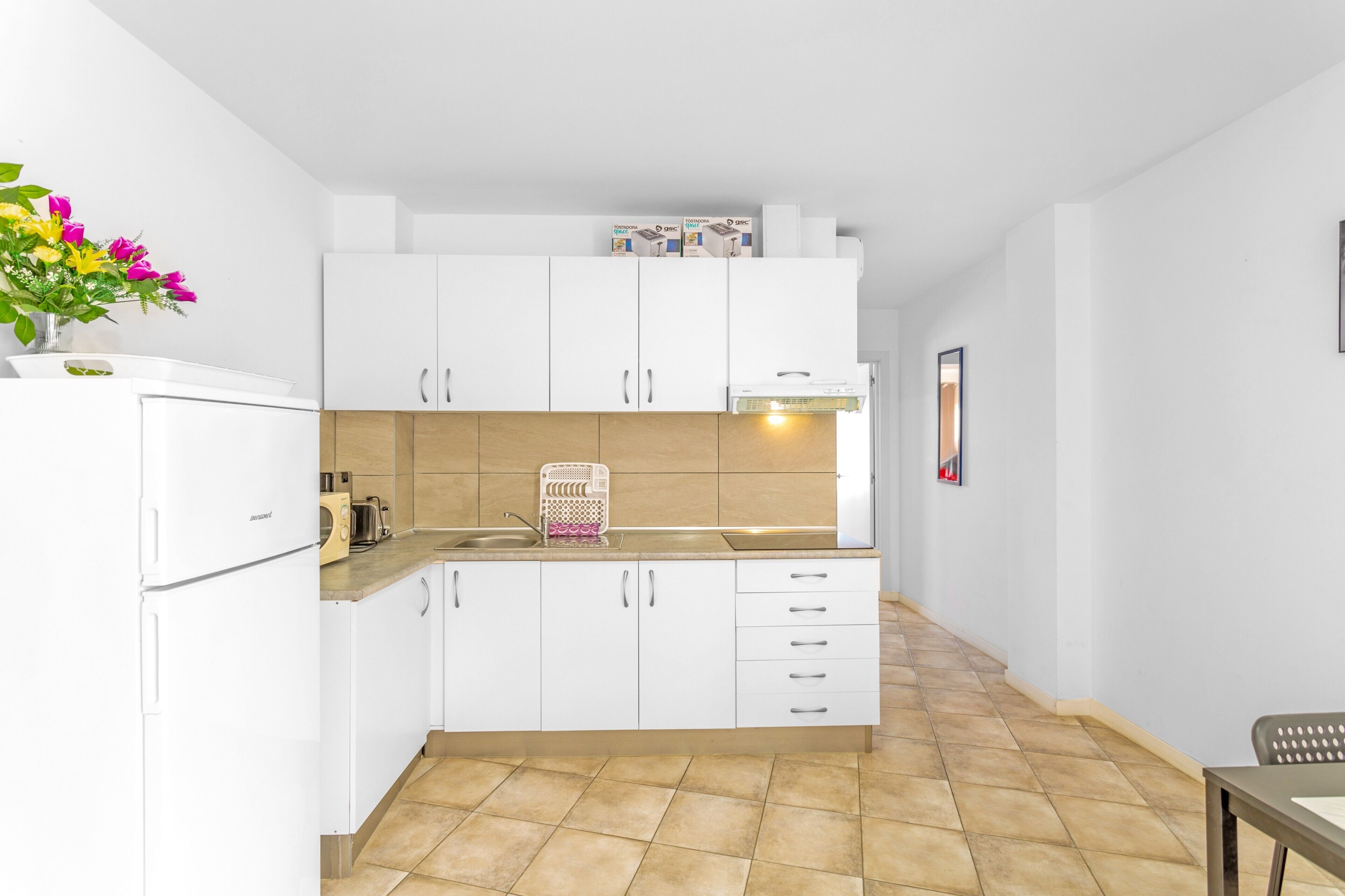 Fridge, microwave, stovetop, coffee/tea maker