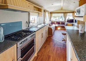Private kitchen - Comfortable and spacious 10ft-wide caravan with one double and one twin. (Perranporth)