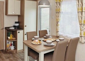 Dining - 12ft-wide caravan with one double and one twin. (Silloth)