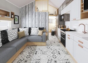 A modern kitchen with a built-in oven, a microwave, and a sink with a faucet.