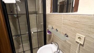 Economy Double Room, 1 Double Bed, Courtyard Area | Bathroom | Shower, rainfall showerhead, hair dryer, towels