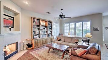 TV, fireplace, books