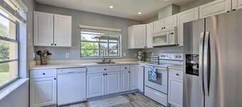 Lanai & Pond at Tranquil Bradenton Retreat!