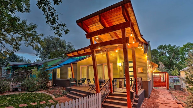 A house with a covered porch, outdoor seating, and a stone pathway leading to the entrance. - Fort Collins Vacation Rental w/ Private Hot Tub! (Fort Collins)