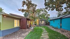A row of single-story houses with a well-maintained lawn and stone pathway. - Fort Collins Vacation Rental w/ Private Hot Tub! (Fort Collins)