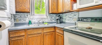 Lakefront Cabin w/ Fire Pit, Dock, & Boat Rental