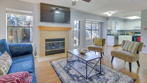 A living room with a sofa, armchairs, a coffee table, a fireplace, and a television. - Austin Vacation Rental w/ Yard ~ 14 Mi to Downtown (Austin)