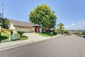 A residential street with a house featuring a garage, a large tree, and a clear sky. - Lovely Solana Beach Home w/ Views: 2 Mi to Ocean! (Solana Beach)