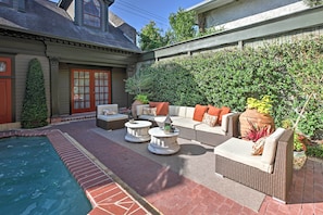 A patio with outdoor furniture, a swimming pool, and a brick pathway. - Dreamy Houston Boho Cottage w/ Private Pool! (Houston)